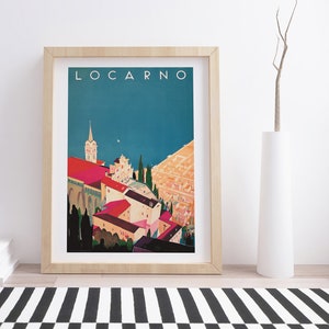 May include: A vintage travel poster with the word "LOCARNO" in white text at the top. The poster features a colorful illustration of a cityscape with a church steeple and buildings in shades of red, pink, and yellow. The background is a blue sky with a hint of water.