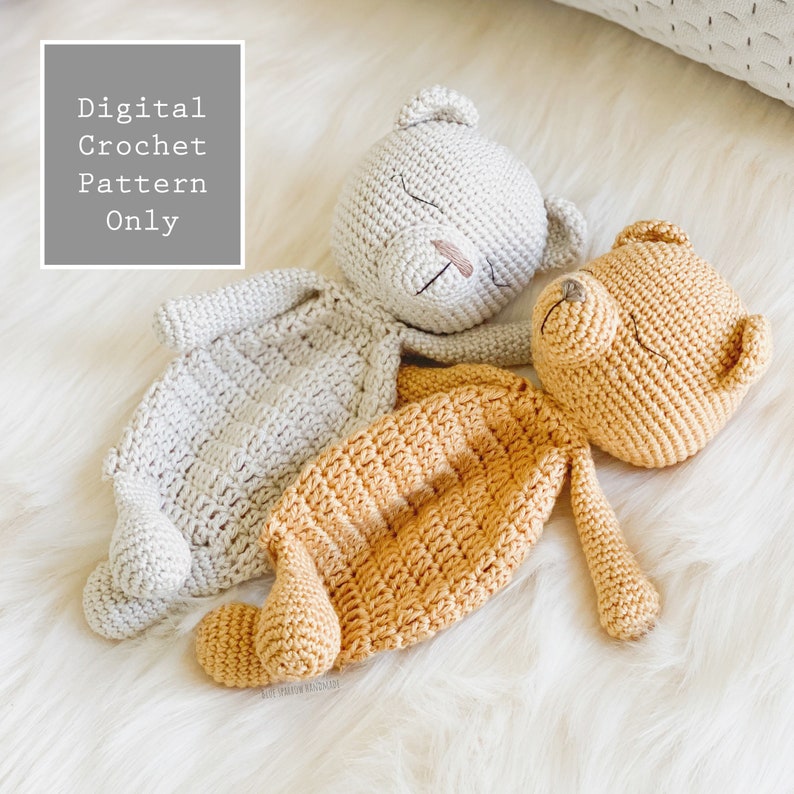 May include: Two crocheted teddy bears, one beige and one orange, lying on a white fluffy surface. The beige bear has its eyes closed and the orange bear has its eyes open. The text "Digital Crochet Pattern Only" is in the top left corner of the image.