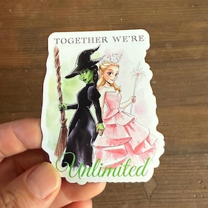 May include: A sticker featuring an illustration of two women from the Wizard of Oz. One is a green-skinned witch in black, holding a broom. The other is a blonde woman in a pink dress, holding a wand. The text "TOGETHER WE'RE Unlimited" is at the top and bottom.