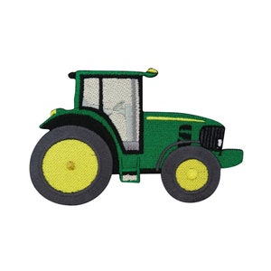 Peut inclure: Tracteur vert et noir avec des roues jaunes. Le tracteur a une calandre noire et une fenêtre grise.