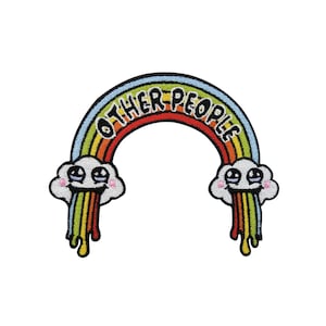 May include: Embroidered rainbow patch with the text "OTHER PEOPLE" in a red, arched font. The rainbow features multiple colours, including blue, yellow, green, and orange. White clouds with smiling faces and colourful drips are at each end.