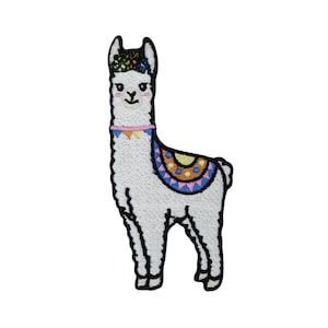 May include: White embroidered llama with a colorful saddle and a pink and blue collar. The llama is standing on a white background.