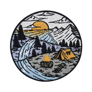 May include: Embroidered patch featuring a camping scene with a tent, campfire, and a river flowing through a mountain landscape. The sun is setting behind the mountains, casting a warm glow over the scene.
