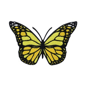 Op de afbeelding: Gele vlinder geborduurde patch met zwarte contouren. De vlinder heeft een gedetailleerd ontwerp met zwarte en gele markeringen.