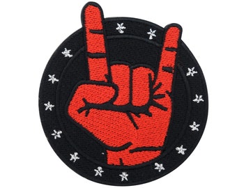 May include: Red embroidered hand making the rock and roll sign, surrounded by a black circle with white stars.