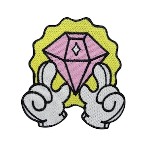 May include: A pink diamond with a white star inside is held by two white gloved hands with black outlines. The diamond is surrounded by a yellow halo with black outlines.