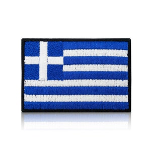 May include: A blue and white embroidered Greek flag patch with a black border.