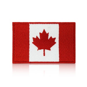 May include: An embroidered Canadian flag patch in red, white and red.