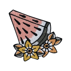 May include: A pink and green watermelon slice with black seeds, surrounded by yellow and orange flowers with white centers. The watermelon and flowers are embroidered on a black fabric.