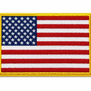 May include: A rectangular embroidered patch featuring the United States flag with a blue canton containing white stars and alternating red and white horizontal stripes, all bordered by a thick, solid yellow stitched edge on a white background.