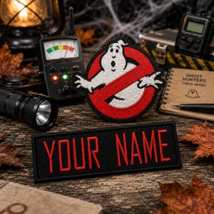 May include: A circular embroidered patch featuring a white ghost character inside a red circle with a diagonal slash, accompanied by a rectangular black patch with the red embroidered text YOUR NAME in a bold, sans-serif font style.