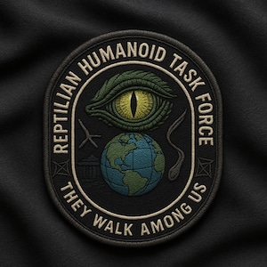 May include: Embroidered patch with the text "Reptilian Humanoid Task Force" and "They Walk Among Us." The patch features a green reptilian eye, a globe, and other symbols. The patch is black with tan and green accents.