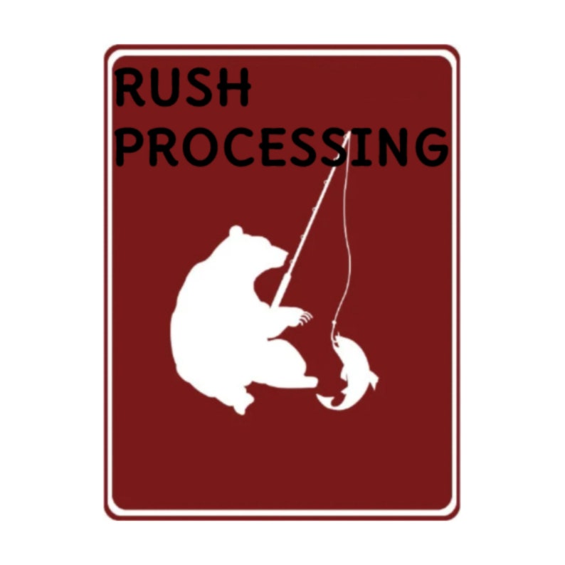 May include: A red sign with white text that reads "RUSH PROCESSING". A white silhouette of a bear fishing is depicted on the sign.