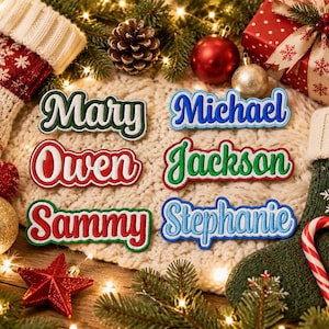 May include: Six embroidered name patches featuring the names Mary in green, Michael in blue, Owen in red, Jackson in green, Sammy in red, and Stephanie in light blue. Each patch has a thick, raised border and a script font style.
