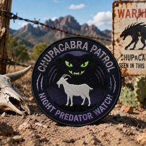 May include: A round black and purple patch with the text "CHUPACABRA PATROL NIGHT PREDATOR WATCH" encircling a white goat and a black silhouette with glowing green eyes. A weathered sign warns of chupacabras.