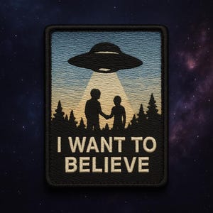 May include: Embroidered patch with a black UFO shining a light on two silhouetted figures holding hands. The patch has a blue and tan background with a forest silhouette. Text reads "I WANT TO BELIEVE".