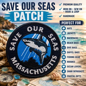 May include: A circular embroidered patch featuring a shark illustration in the center with the text SAVE OUR SEAS MASSACHUSETTS. The patch has a dark blue border and a blue background with white rays. It includes text indicating iron-on, sew-on, and hook-and-loop options.