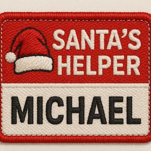 May include: Embroidered patch with a red background and a white border. The patch features a Santa hat graphic and the text "SANTA'S HELPER" in white, with the name "MICHAEL" in black.