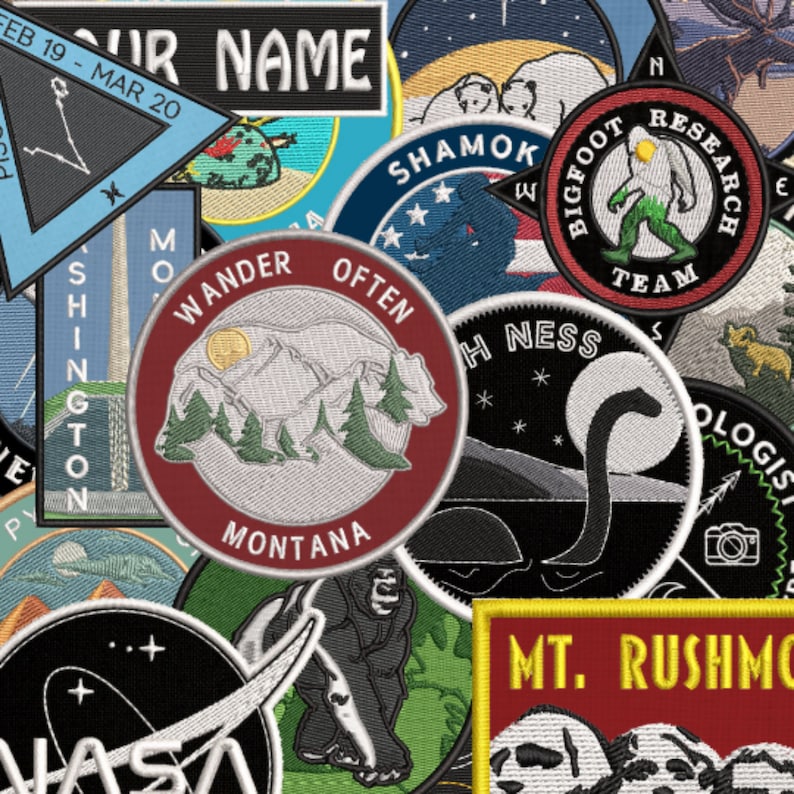 Puede incluir: Una colecci&oacute;n de parches bordados con varios dise&ntilde;os, incluyendo un emblema del Bigfoot Research Team, una escena de monta&ntilde;a Wander Often Montana, una silueta del monstruo del Lago Ness, un logo de la NASA y un parche de Mt. Rushmore con texto amarillo.