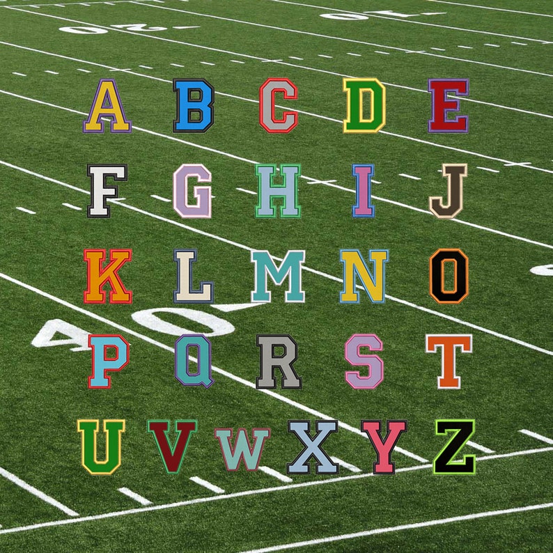 May include: A green football field with white lines and the letters of the alphabet in different colors and fonts. The letters are arranged in rows of five, starting with A and ending with Z.