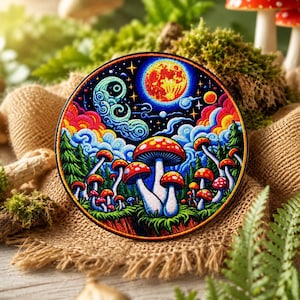 May include: A circular embroidered patch featuring a vibrant night scene with a large red moon, a swirling blue crescent moon, and colorful clouds above a forest of red-capped mushrooms. The design uses bright shades of blue, red, and yellow.