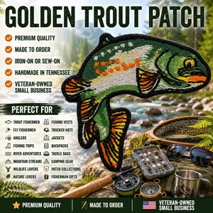 May include: An embroidered patch shaped like a golden trout with green, white, and orange thread details. The patch features a black border and depicts the fish in a curved, jumping position. Text on the image includes GOLDEN TROUT PATCH.