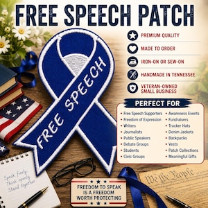 May include: A blue and white embroidered ribbon patch featuring the text FREE SPEECH. The patch is displayed alongside text listing features like premium quality, iron-on or sew-on application, and handmade in Tennessee, plus a list of uses.