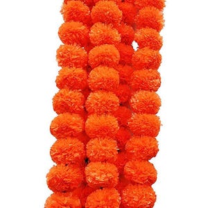 May include: A vertical string of bright orange marigold flowers, closely arranged. The flowers are spherical and fluffy, giving a textured look. The background is plain white.
