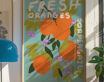 May include: A framed poster with a blue background and a hand-drawn illustration of an orange tree with oranges and purple flowers. The text on the poster reads "FRESH ORANGES" and "SORRENGAIL PICK YOUR OWN POISON, Choose VIOLENCE".