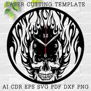 May include: Black and white laser cut clock design featuring a skull with flames. The clock face has Roman numeral markings for the hours.