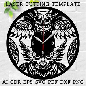 May include: Black and white laser cut clock design featuring two owls with intricate details. The clock face has Roman numerals and a clock hand design. The text "LASER CUTTING TEMPLATE" is at the top of the image. The text "AI CDR EPS SVG PDF DXF PNG" is at the bottom of the image.