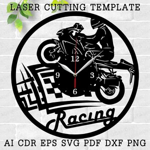 May include: Black and white laser cut clock design featuring a motorcycle racer and the word "Racing". The clock face has numbers 12, 9, 3, and 6.