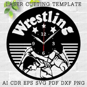 May include: Black and white laser cut clock design featuring two wrestlers in a grapple. The clock face has Roman numerals and the word "Wrestling" in a stylized font.
