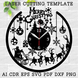 May include: Black and white laser cut design template of a Christmas clock with reindeer, Santa Claus, snowflakes, and the words "Merry Christmas".