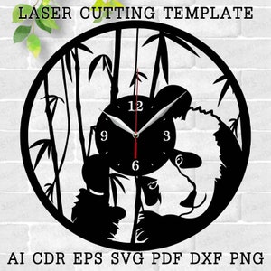 May include: Black and white laser cut design of a panda bear in a bamboo forest with a clock face in the center. The clock face has black numbers and hands. The design is suitable for a wall clock.
