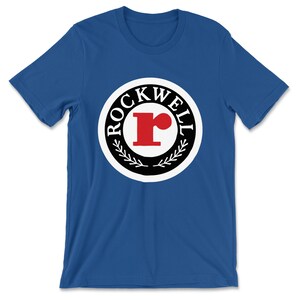 Rockwell — 1966-1973 Emblem (Solid) T-Shirt (Multiple Colors)