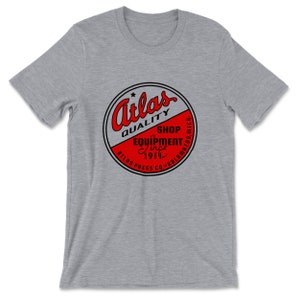 Atlas Press Co. — &quot;Atlas Quality&quot; Emblem (Tangerine Clear) T-Shirt (Multiple Colors)