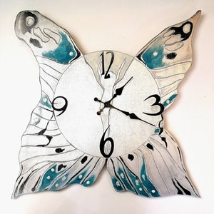 Wooden wall clock in the shape of a butterfly