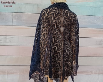 May include: A navy blue, open-weave shawl with a delicate leaf pattern. The shawl is draped over a mannequin, showcasing its intricate design and scalloped edges. The text "Rankdarbių Kavinė" is visible in the upper left corner.