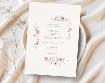 May include: A wedding invitation with a floral border. The invitation reads "Kindly join us for the wedding of Anna and Preyston, August 20th at 3 PM, 123 Anywhere St, Any City, AT 12345."