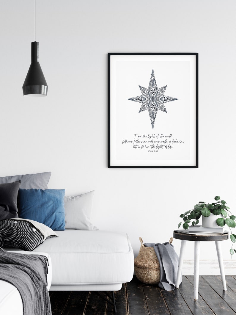 May include: A black and white printable wall art print with a star design and the text "I am the light of the world. Whoever follows me will never walk in darkness, but will have the light of life. John 8:12"