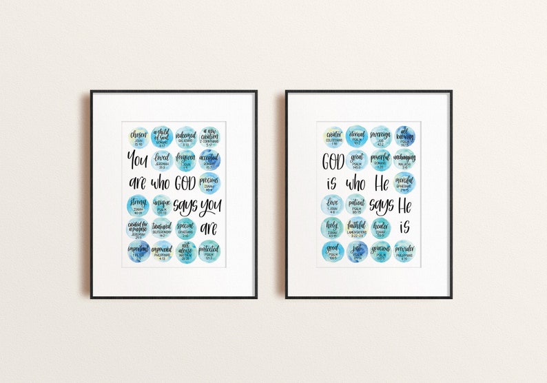 May include: Two framed prints with watercolour backgrounds and white text. The left print says "You are who God says you are" with a list of words describing people. The right print says "God is who He says He is" with a list of words describing God.