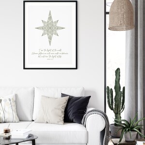 May include: A printable wall art design featuring a stylized star with a floral pattern in shades of green. The text below the star reads "I am the light of the world. Whoever follows me will never walk in darkness, but will have the light of life." John 8:12