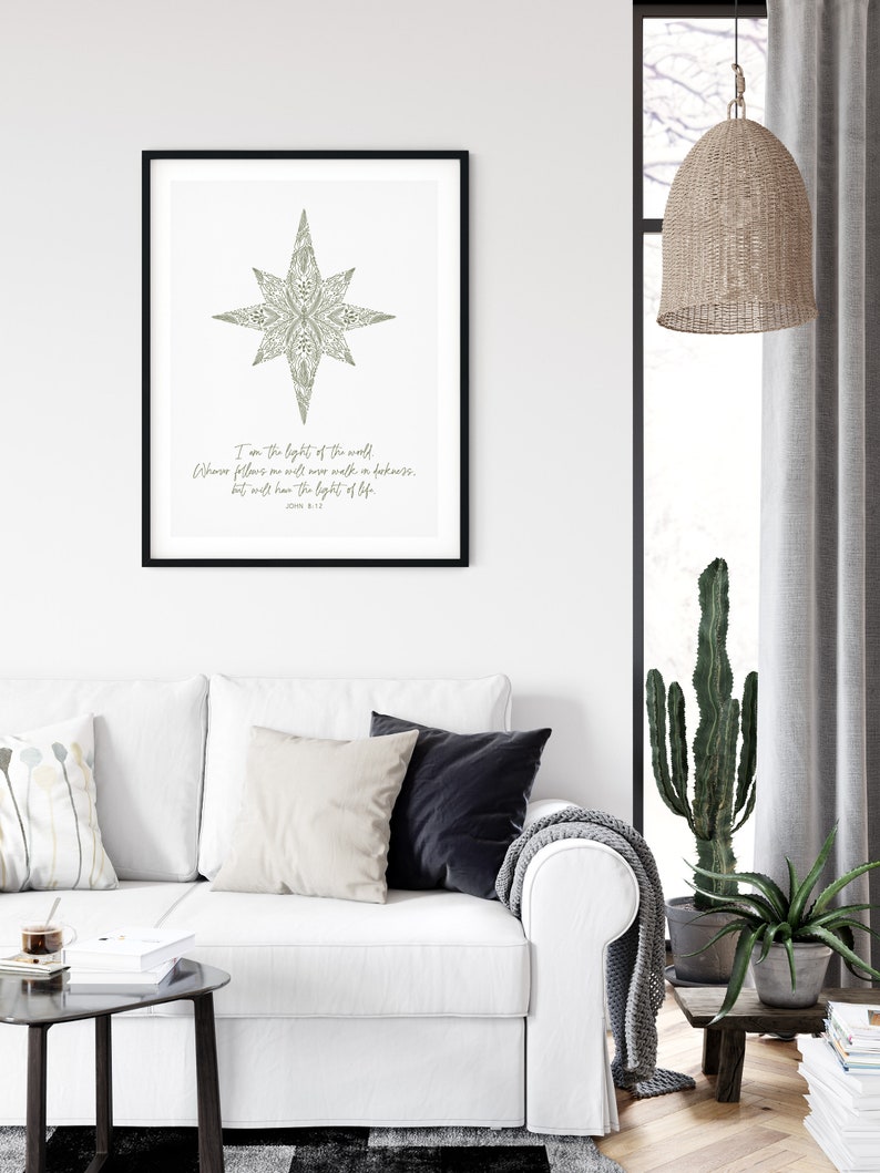May include: A printable wall art design featuring a stylized star with a floral pattern in shades of green. The text below the star reads "I am the light of the world. Whoever follows me will never walk in darkness, but will have the light of life." John 8:12