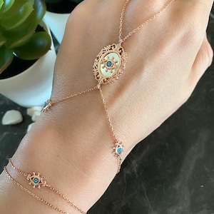 Cadena de mano de mal de ojo espejada