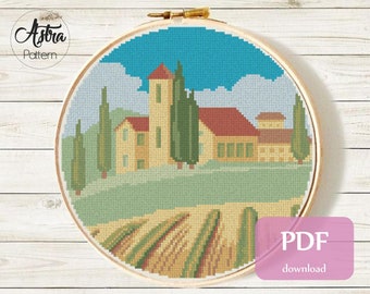 May include: Counted cross stitch pattern for a countryside scene featuring a house, trees, and a field. The pattern is for 14 count Aida fabric and measures 7.6 inches by 7.6 inches. The pattern includes 106 stitches wide by 106 stitches high and uses DMC colours.