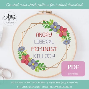 May include: Counted cross stitch pattern for a 9x9 inch embroidery hoop featuring a floral wreath with the text "Angry Liberal Feminist Killjoy". The pattern is for 14 count Aida fabric and uses 10 DMC colours.