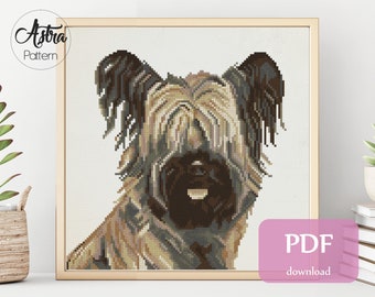 May include: Counted cross stitch pattern for a dog with brown, black, and beige fur. The pattern is for 14 count Aida fabric and measures 7.8 inches by 7.8 inches. The pattern uses 13 colors of DMC floss.