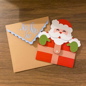 Porte-cartes / porte-monnaie de Noël Père Noël. Emballage cadeau festif.
