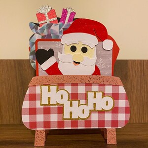 Carte de boîte de Noël en traîneau du Père Noël 3d. Carte de voeux festive. Sac / cadeau / cadeaux.